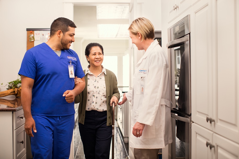 health care workers helping patient