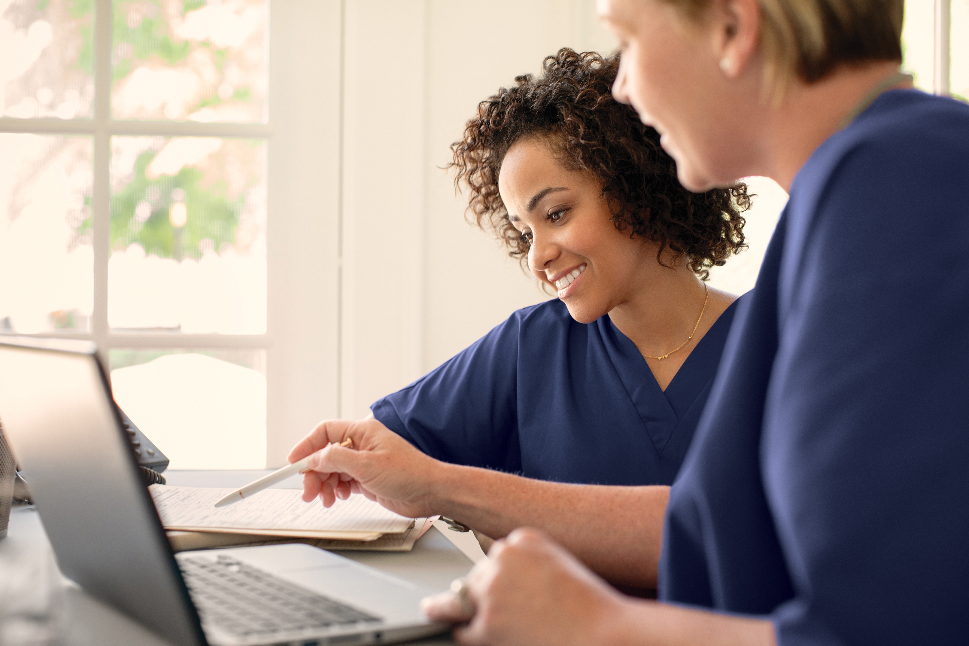 brightstar care caregivers at a computer