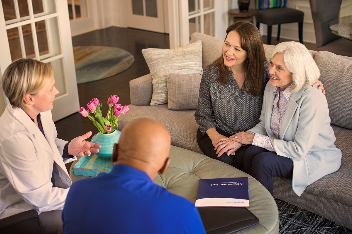 health care workers discussing with the patient