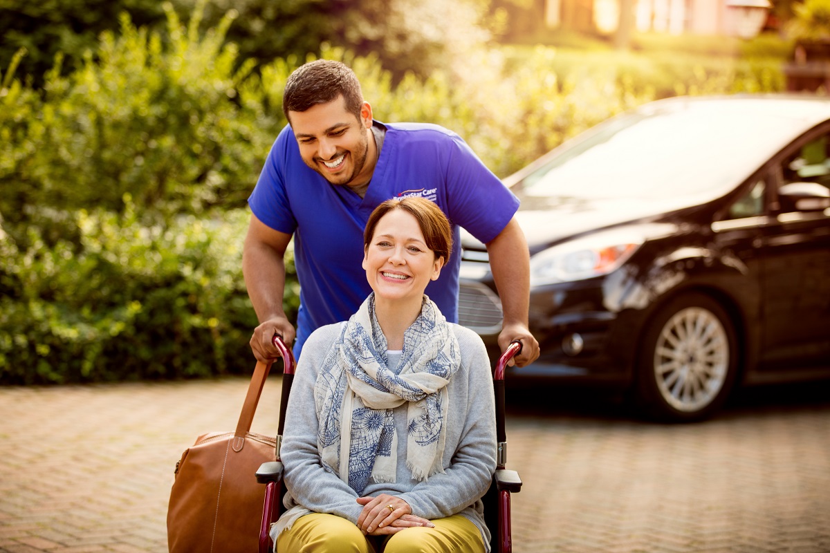 caregiver helping senior citizen