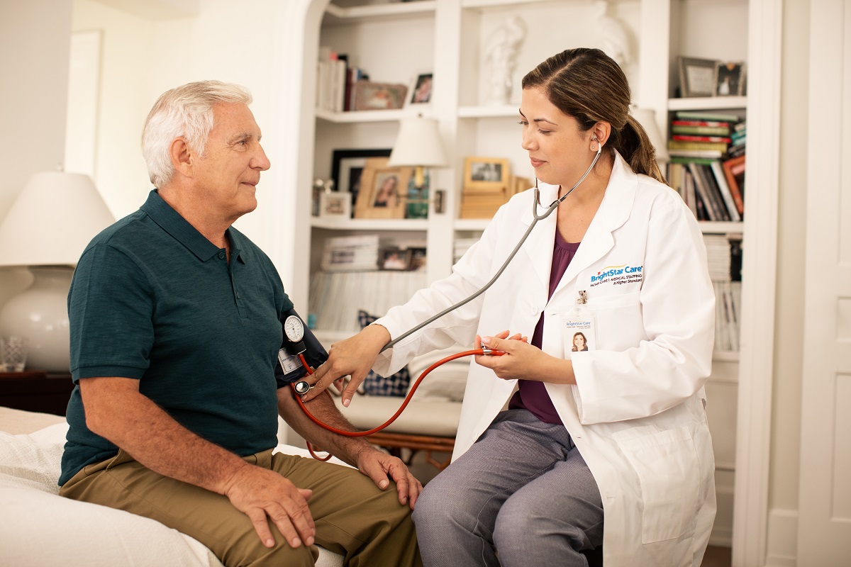 health care worker checking the patient