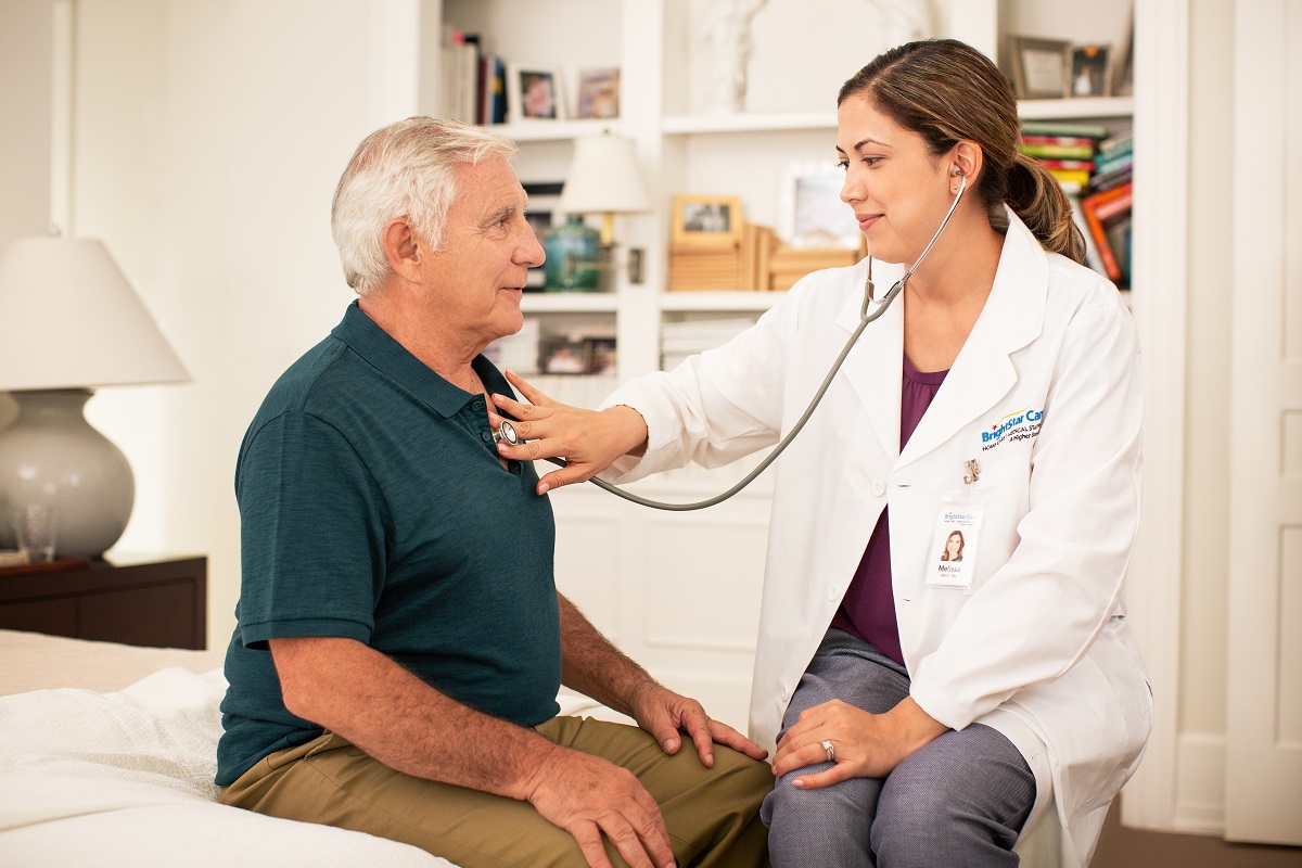 health care worker checking the patient