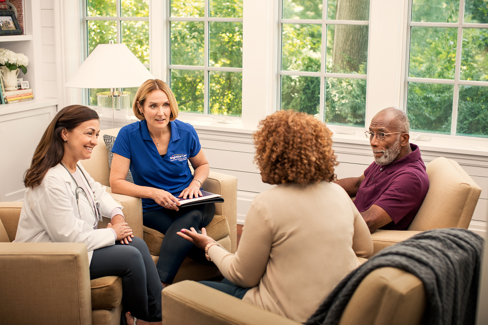 health care workers discussing with the patient