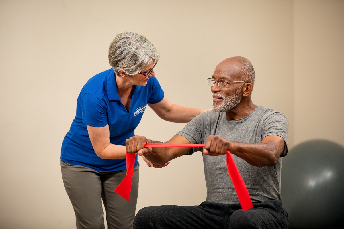 health care worker helping patient