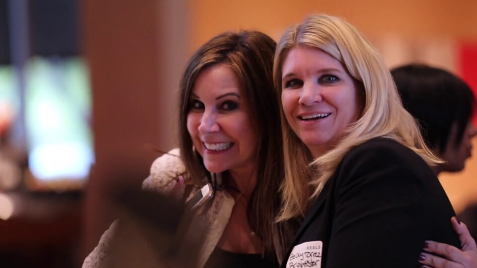 two women smiling