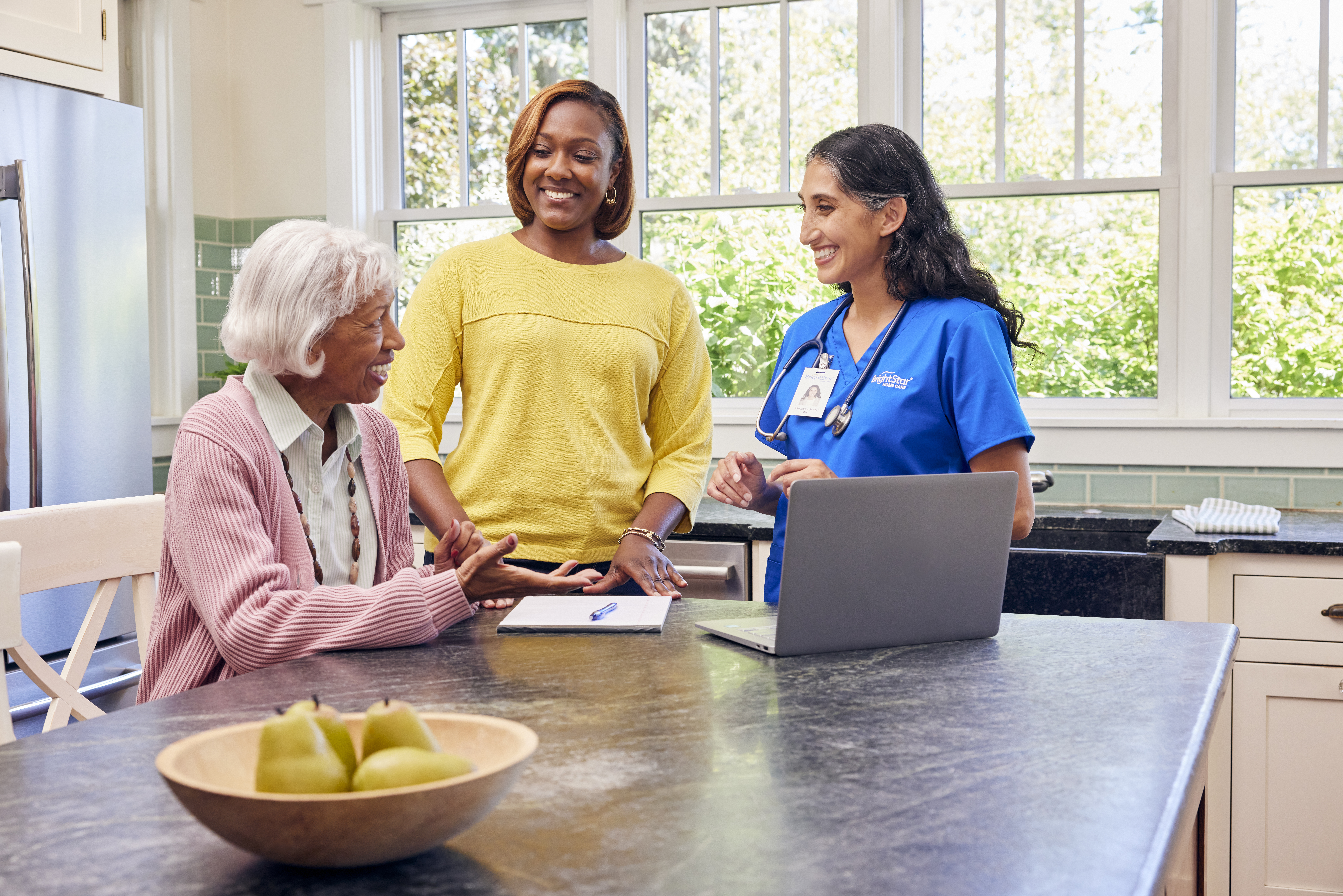 Caregiver helping an elderly woman