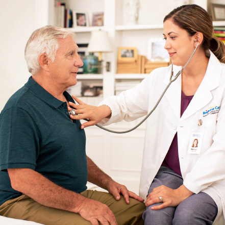 Caregiver using stethoscope
