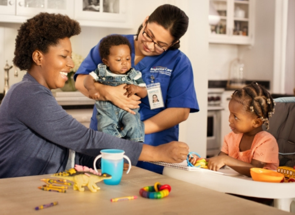 nurse with mother and children